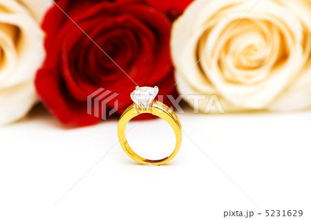 Engagement ring and roses at the background Engagement ring and roses at the background 5231629