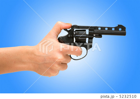 Hand holding revolver isolated on the white 5232510