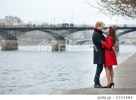 Romantic couple in love hugging near Pont des Arts in Paris 5233484