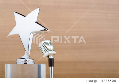 Star award against wooden background 5236500