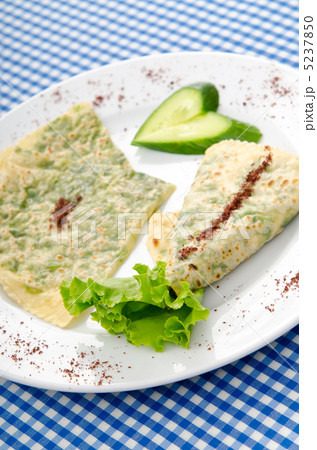Pancake with herbs in the plate Pancake with herbs in the plate 5237850
