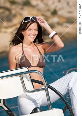 Young woman sailing on luxury yacht 5244382