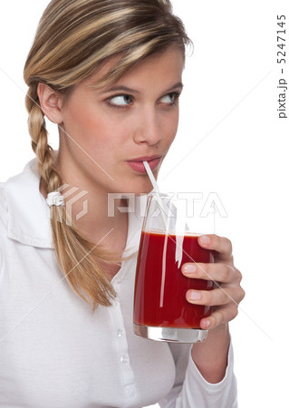 Healthy lifestyle series - Woman drinking tomato juice Healthy lifestyle series - Woman drinking tomato juice 5247145
