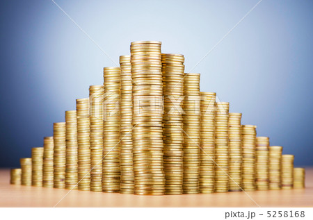 Golden coins in high stacks 5258168