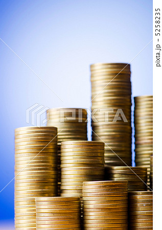Golden coins in high stacks 5258235
