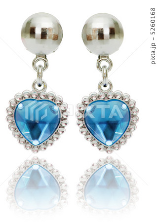 Silver earrings isolated on the white background Silver earrings isolated on the white background 5260168