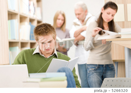High school library - Student with book 5266320