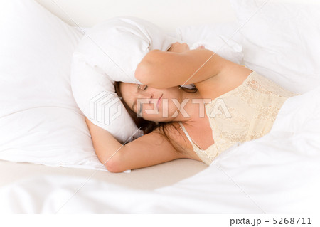 Bedroom - lazy woman getting up 5268711