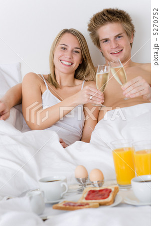Luxury hotel honeymoon breakfast - couple in bed 5270752
