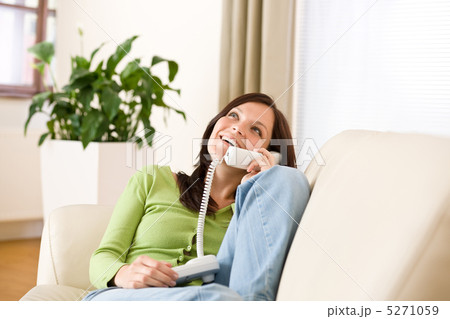 On the phone home: Happy woman calling On the phone home: Happy woman calling 5271059