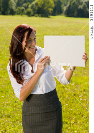 Businesswoman sunny meadow look at empty banner 5291111
