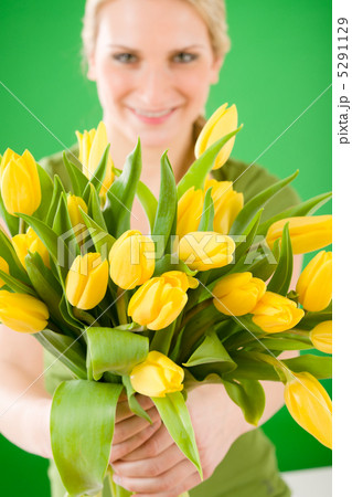 Young woman hold yellow tulips flower Young woman hold yellow tulips flower 5291129