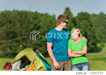 Young camping couple hugging in summer countryside Young camping couple hugging in summer countryside 5291732