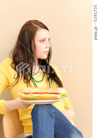 Young happy student girl eat fresh sandwich Young happy student girl eat fresh sandwich 5291735
