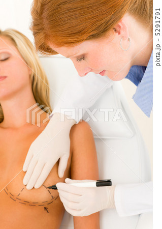 Plastic surgery doctor draw line patient breast 5291791