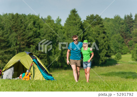 Young camping couple hugging in summer countryside 5291792