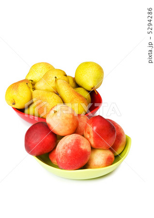 Plates with peaches and nectarines on the white Plates with peaches and nectarines on the white 5294286