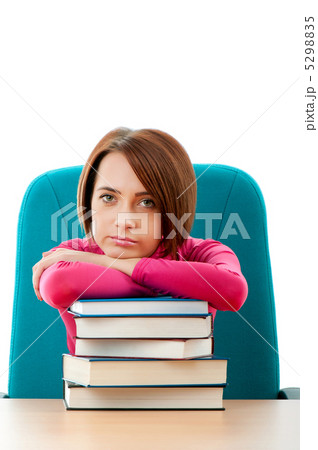 Young female student with many study books 5298835