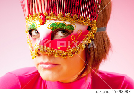 Attractive woman posing in the stylish mask 5298903