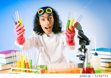 Chemist in the lab experimenting with solutions 5299752