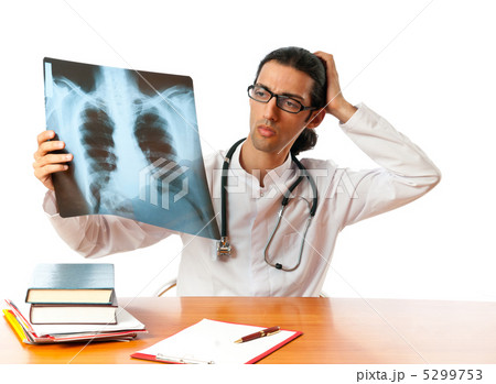 Male doctor looking at x-ray image 5299753