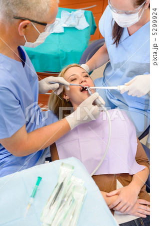 Woman at dentist surgery have treatment 5299924