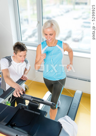 Young fitness instructor woman running at gym 5299925