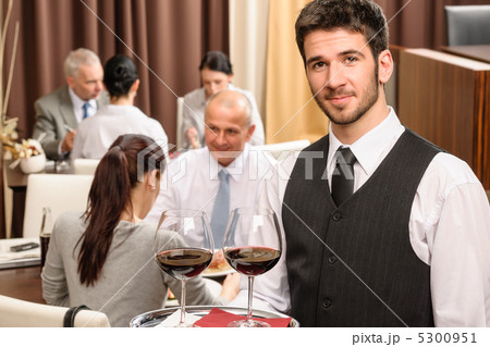 Waiter hold wine glasses business lunch restaurant Waiter hold wine glasses business lunch restaurant 5300951