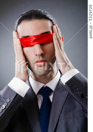 Businessman blinded by red tape 5329726