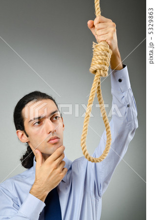 Businessman with thoughts of suicide Businessman with thoughts of suicide 5329863