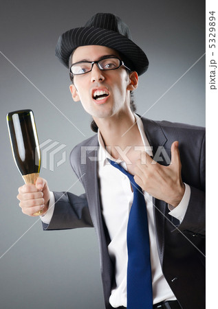 Businessman with bottle of champagne Businessman with bottle of champagne 5329894