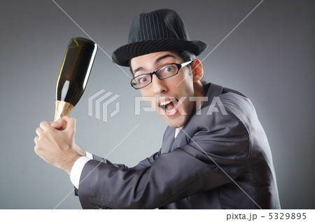 Businessman with bottle of champagne 5329895