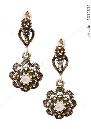 Pair of earrings isolated on the white background Pair of earrings isolated on the white background 5332332