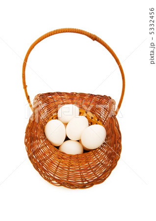 Basket full of eggs isolated on white 5332456