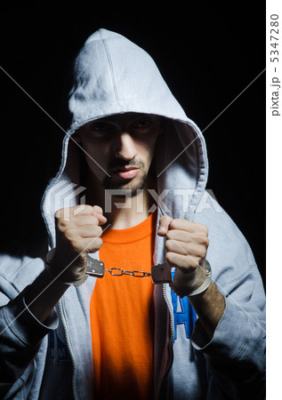 Young criminal with handcuffs Young criminal with handcuffs 5347280