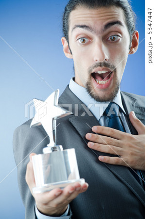 Businessman awarded with star award Businessman awarded with star award 5347447
