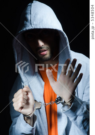 Young criminal with handcuffs Young criminal with handcuffs 5348504