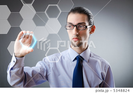 Businessman pressing virtual buttons Businessman pressing virtual buttons 5348824