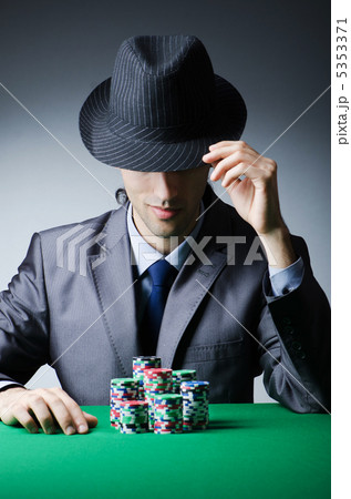 Man playing in the casino Man playing in the casino 5353371
