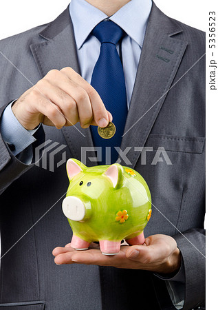 Man saving his money in the piggybank 5356523