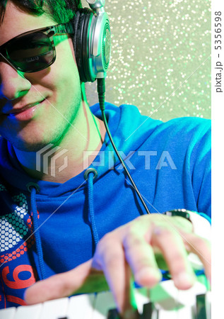 Young DJ playing his music 5356598