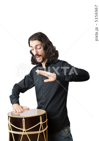 Drummer with drum playing on white Drummer with drum playing on white 5356967