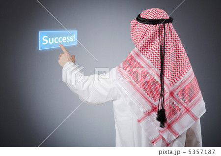 Young arab pressing virtual buttons Young arab pressing virtual buttons 5357187