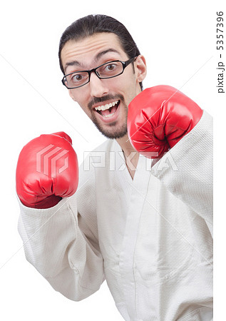 Karate fighter isolated on the white Karate fighter isolated on the white 5357396