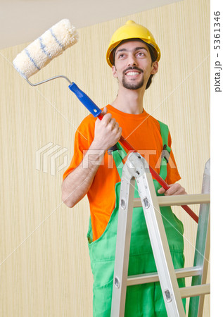 Painter worker during painting job Painter worker during painting job 5361346