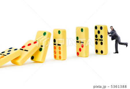 Businessman and dominoes isolated on the white Businessman and dominoes isolated on the white 5361388