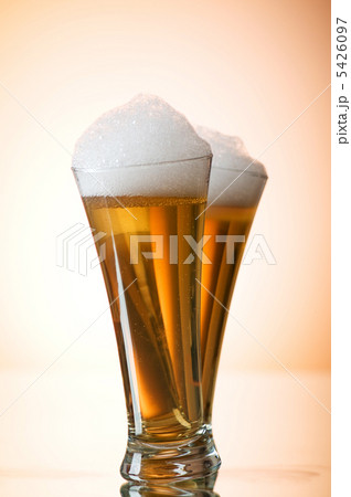Beer glasses against the colorful gradient background Beer glasses against the colorful gradient background 5426097