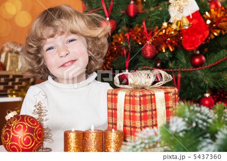 Happy child with gift 5437360