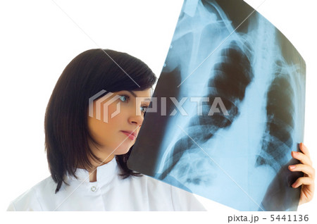 Female doctor looking at x-ray image on white 5441136