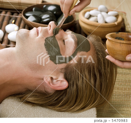 Spa. Handsome Man with a Mud Mask on his Face 5470983